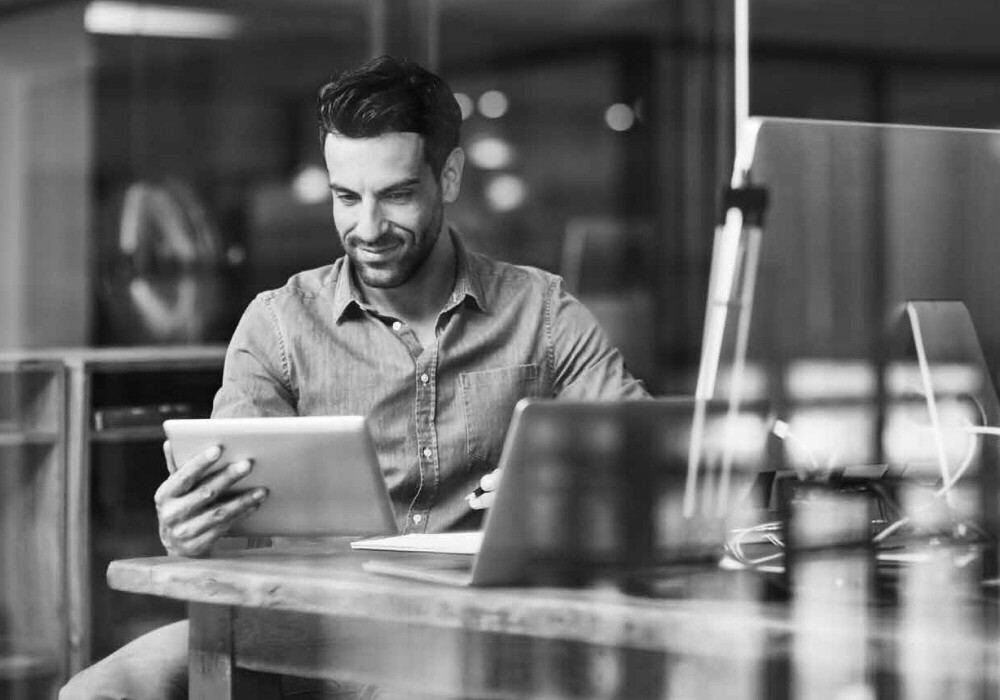 Man looking at tablet