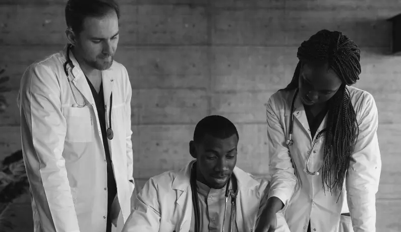 Doctors discussing over a desk