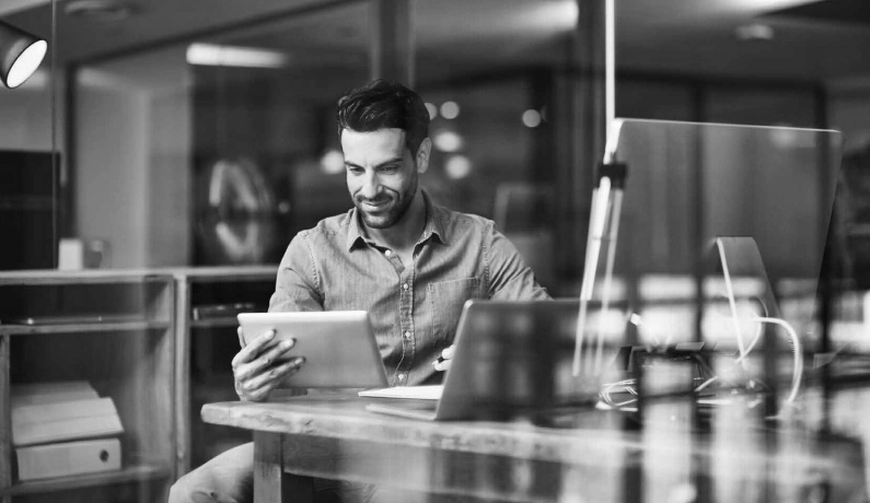 Man looking at tablet