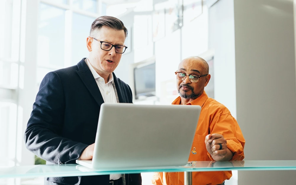 Men working on a laptop