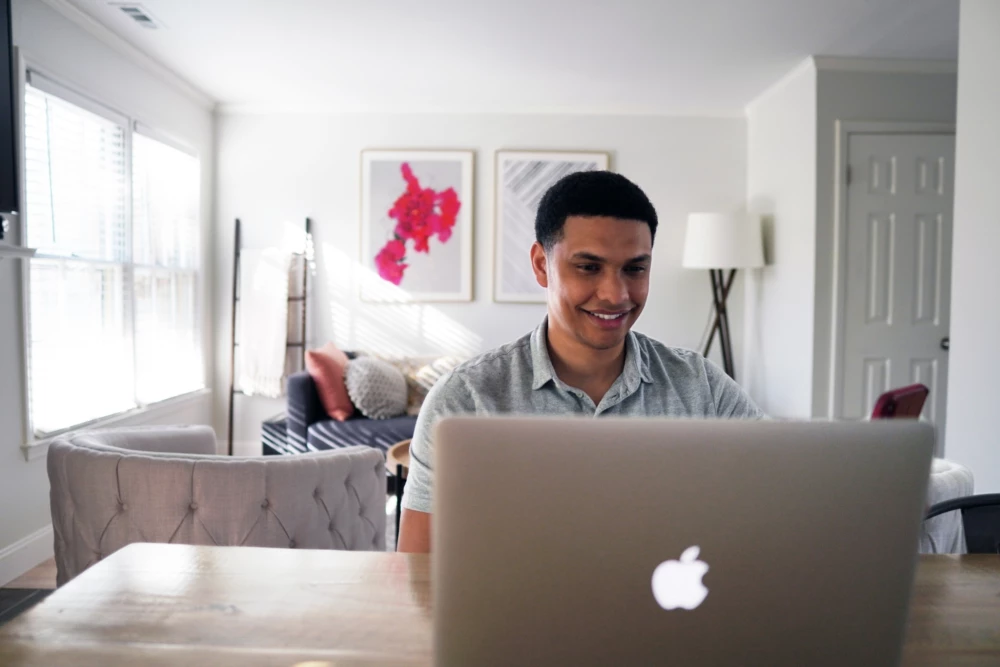 Man at laptop in home office