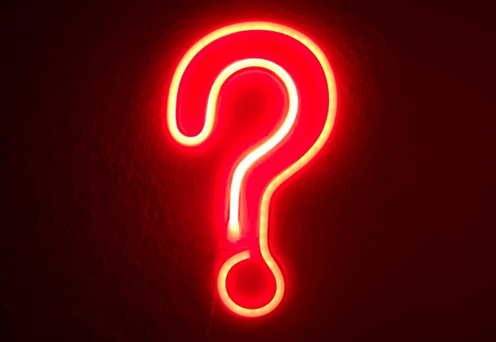 A red neon question mark sign