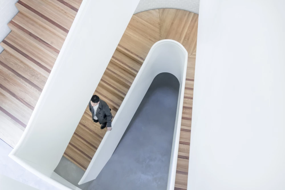 Man walking down stair case