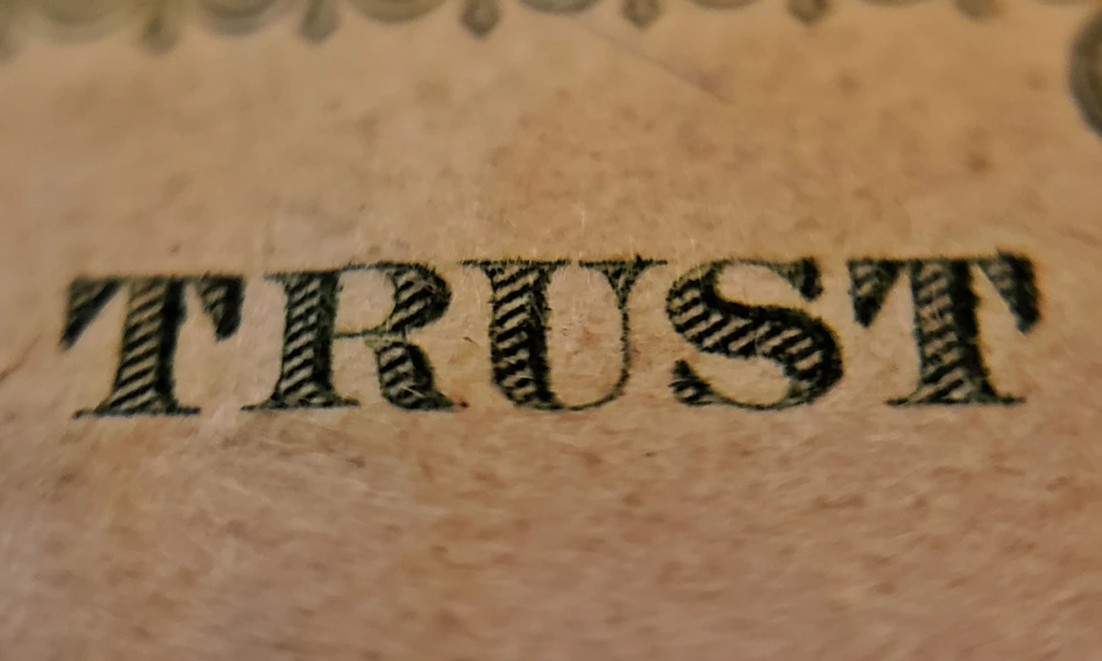 Close-up of the word TRUST