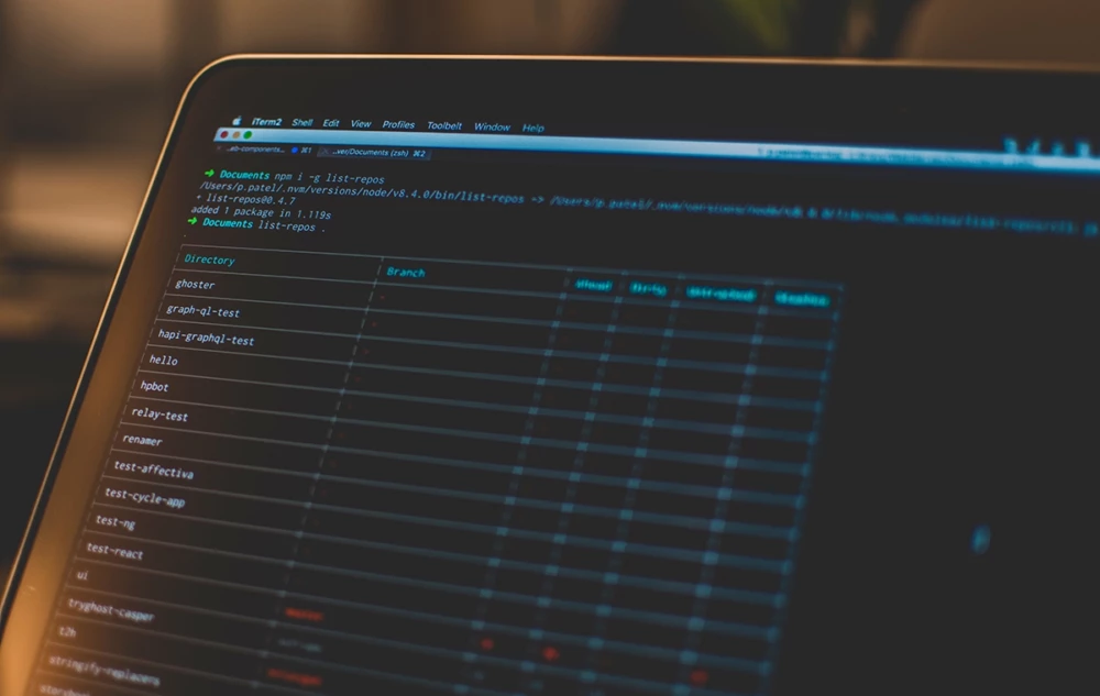 Laptop screen displaying a dark-themed code editor