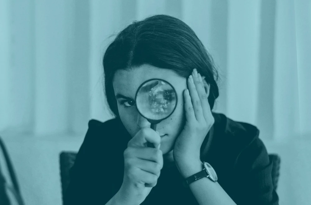 Girl with magnifying glass