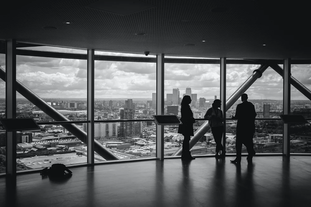 Office workers talking near window